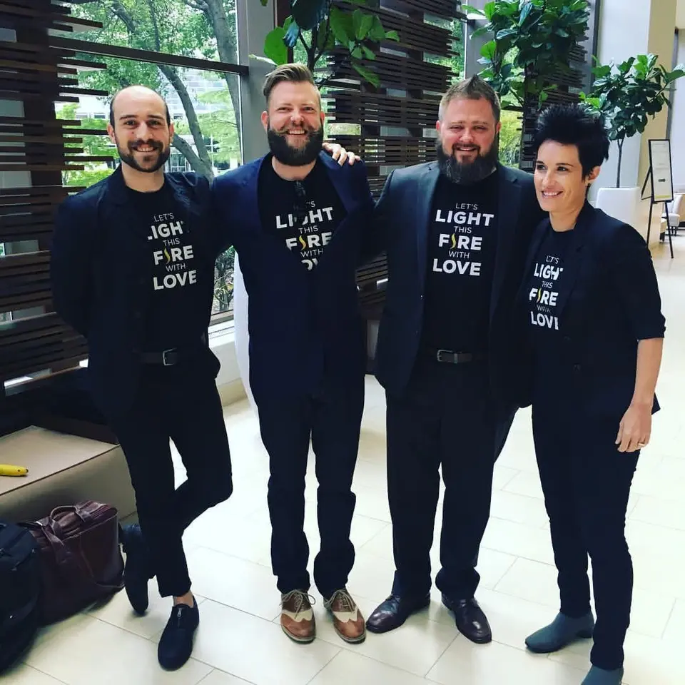 The Be The Change Revolutions team wearing Light This Fire With Love shirts